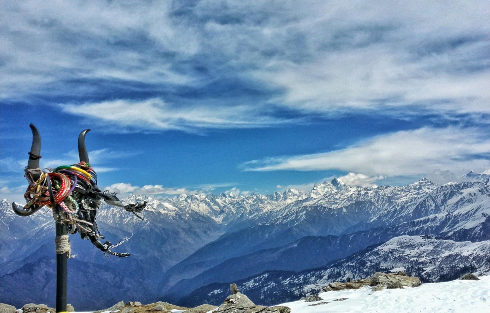 Snow-covered Kedarkantha trek view with white Himalayan peaks and winter landscape